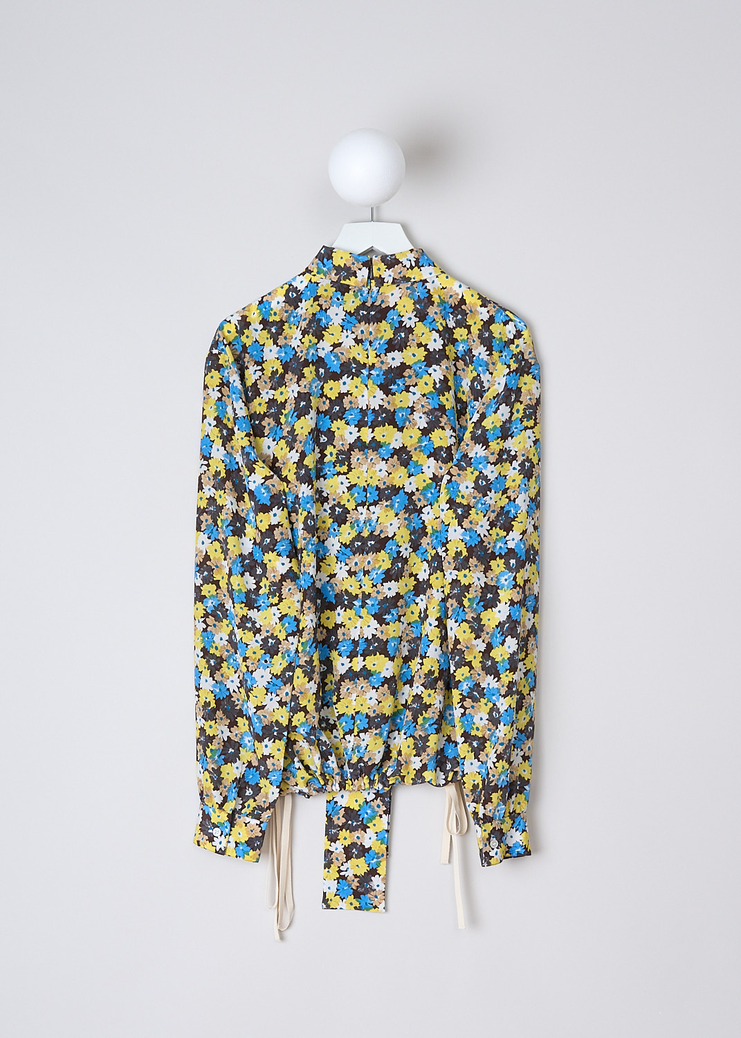 PLAN C, DAISY BOUQUET CRÊPE DE CHINE BLOUSE, CMCAD55K00_TS011_FIY04, Yellow, Print, Blue, Back, This long sleeve Crêpe de Chine blouse has an all-over Daisy Bouquet print. The blouse has a bow-tie neckline. An inverted pleats runs vertically down the front. The long sleeves have buttoned cuffs. The blouse has a hemline with drawstrings on either side. In the back of the neck, the blouse has a concealed centre zip.


